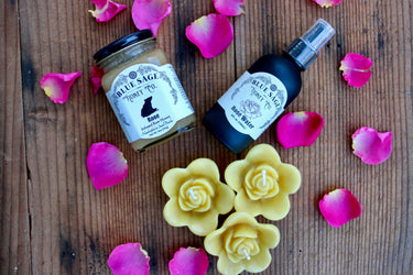Rose gift set with beeswax candles, rose honey, and rose water spray