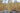 Large pale yellow beeswax pillar candle with embossed fern pattern