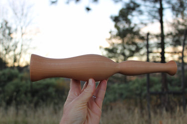 Asymmetrical design of hand carved wooden fermentation masher