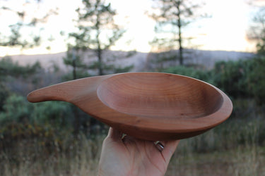 Hand-carved madrone wood catchall bowl with asymmetrical teardrop handle