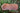 Top view of asymmetrical natural edge Madrone wooden tray with fluid grain patterns