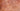 Extreme close-up of smooth polished Madrone wood texture with concentric rosy gold swirls