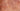 Extreme close-up of smooth polished Madrone wood texture with concentric rosy gold swirls