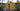 Hand-processed yellow beeswax bricks on rustic wood