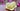 hand holding yellow beeswax floating rose candle