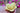 hand holding yellow beeswax floating rose candle