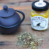 Chamomile herbal tea served in cast iron teapot with turmeric honey