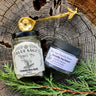 The Inquisitive Chefs Bundle with lemon sea salt, butterfly pea flower powder, and brass bee spoon on wood