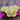 image of three floating rose candles made of yellow beeswax with a cotton wick